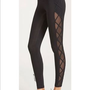 Black lulu pant with mesh sheer sides/criss cross